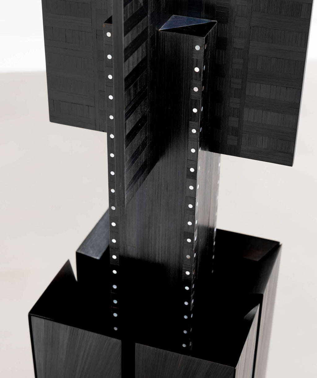Close up of a geometric sculpture with subtle woven texture
