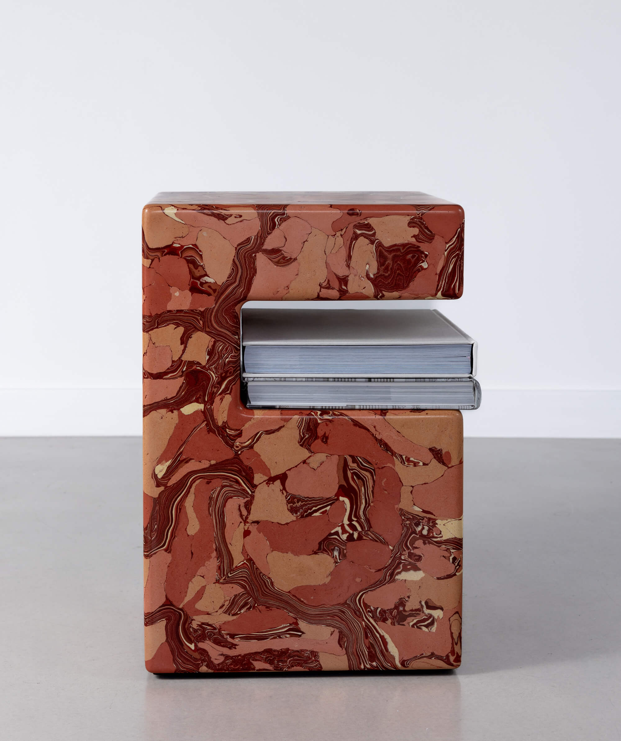 Marble patterned sscagliola block sculptures holding books