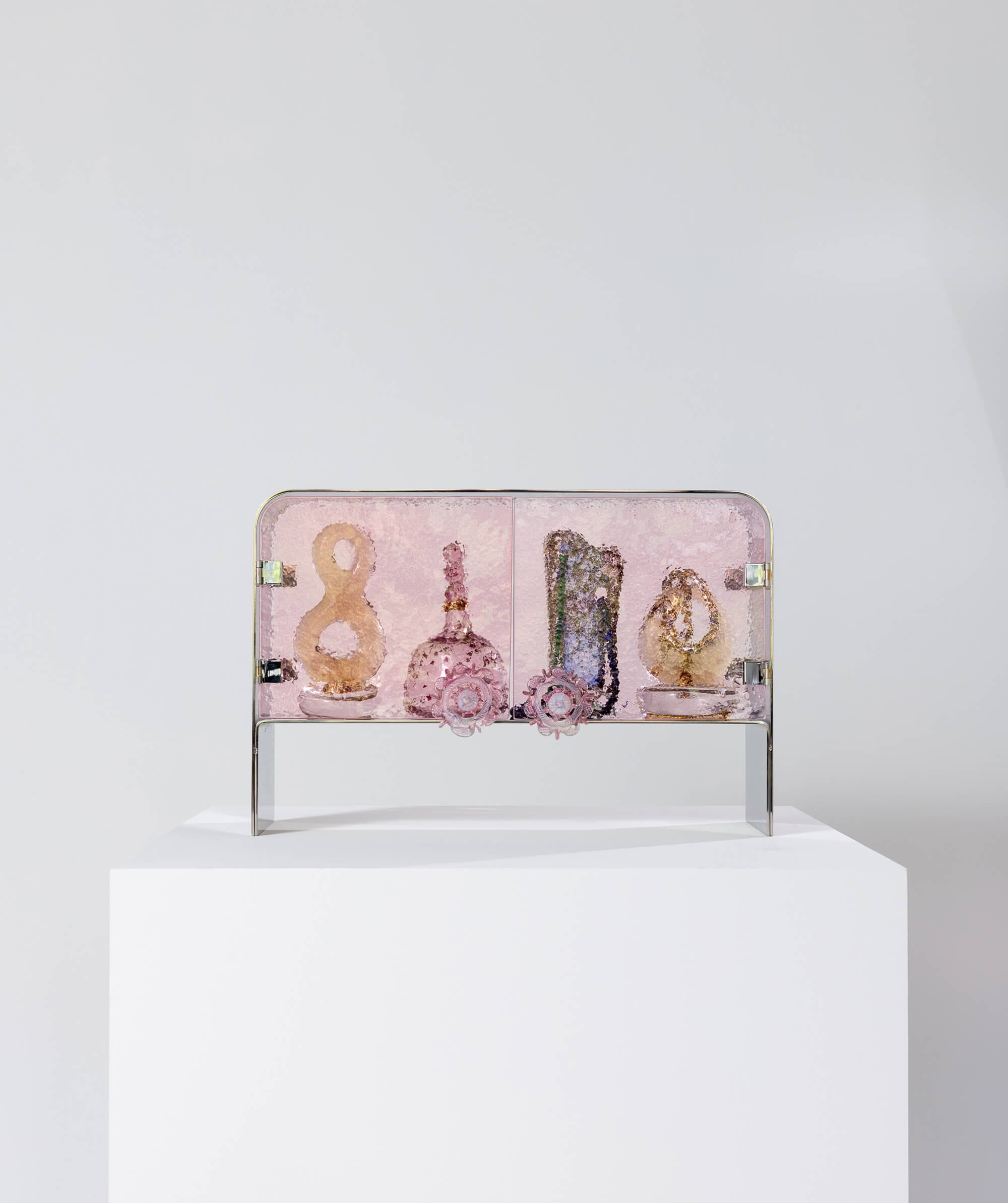 Pink textured glass and steel structured cabinet with doors fully closed